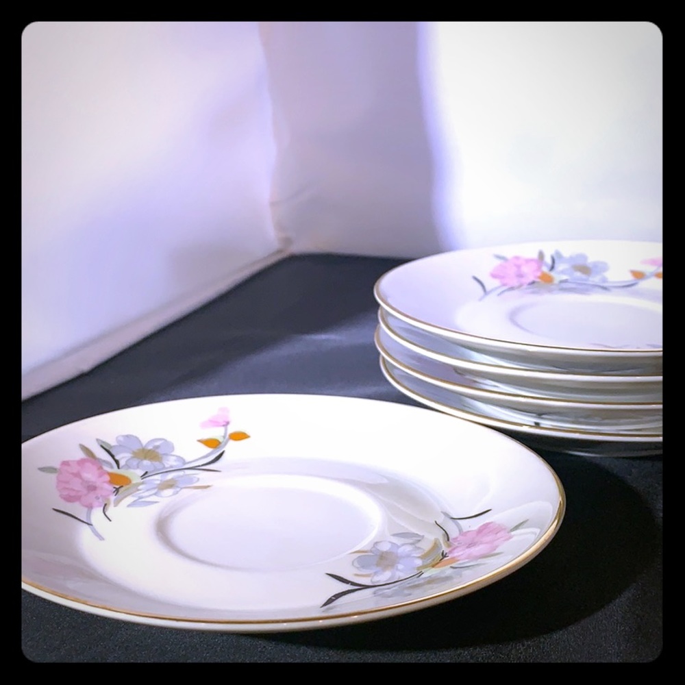 Five tea/coffee saucers. Hand painted. Imported.